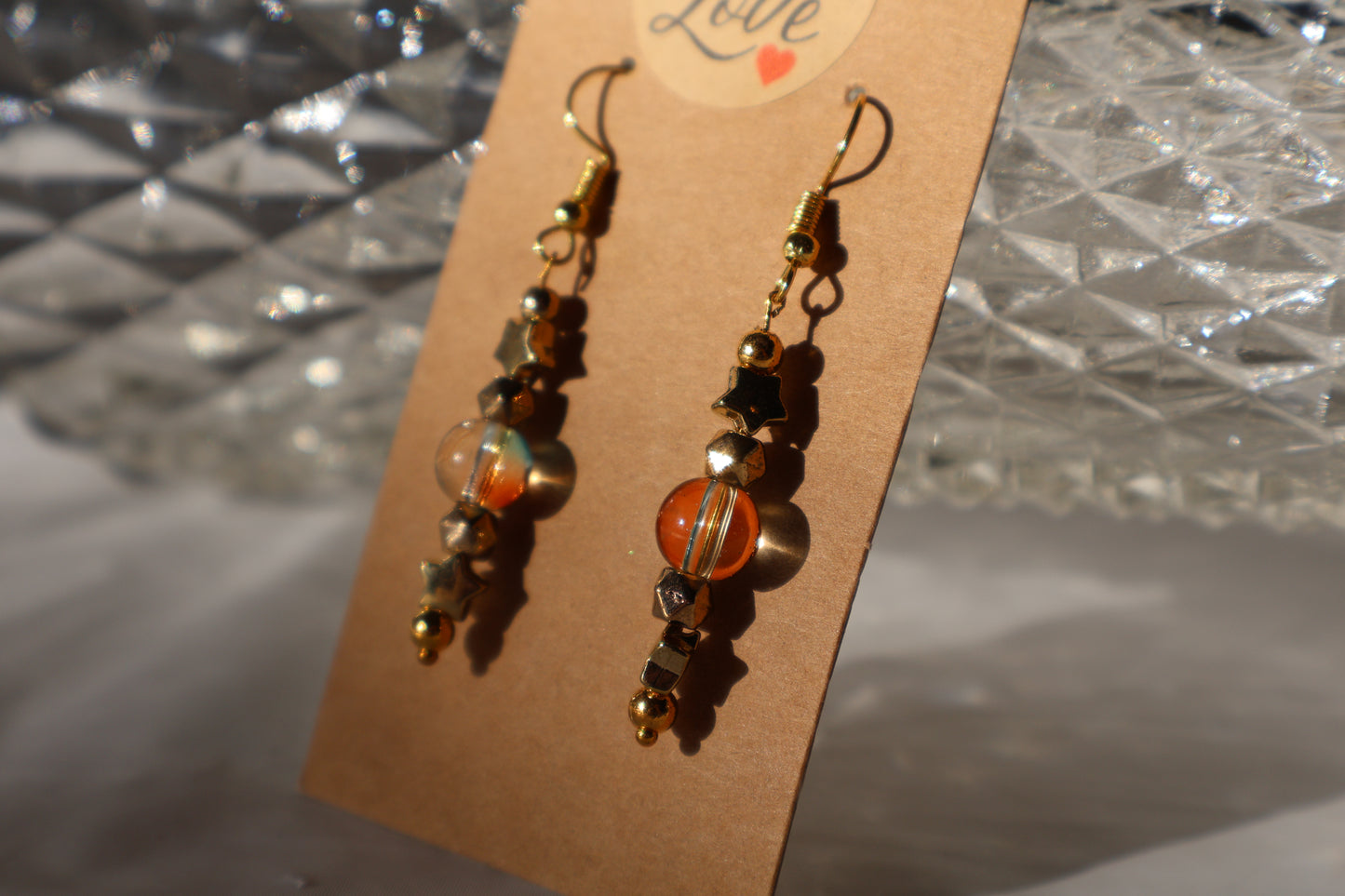 Starry Dangle Earrings with Beautiful Green and Orange Tinted Glass Bead - Premium Earrings from Zee's Pieces - Just $15! Shop now at Zee's Pieces