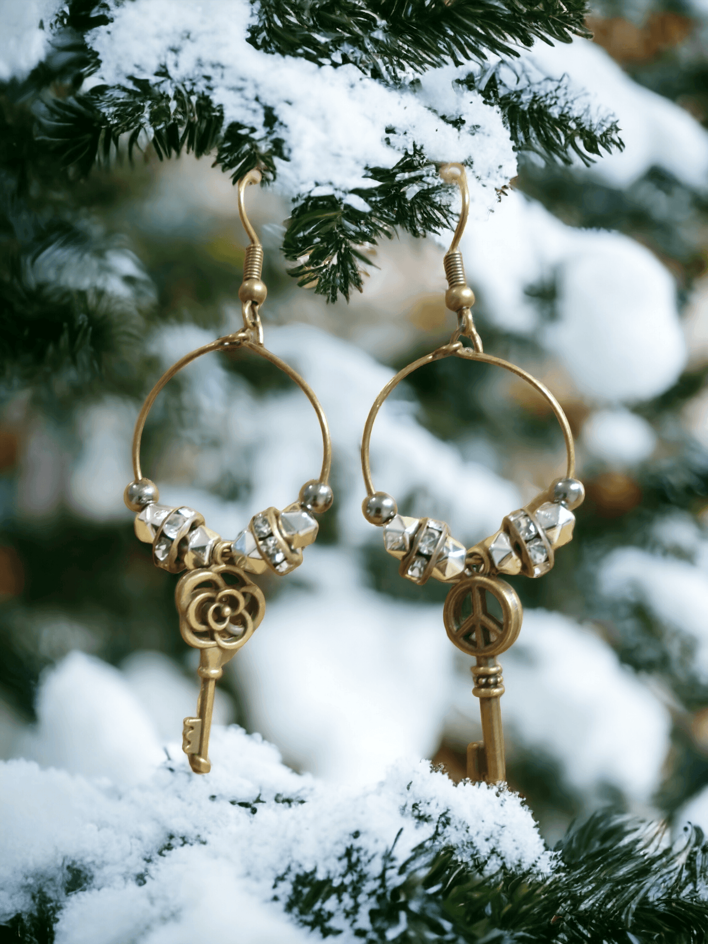 Unique earrings with bronze-colored hoops, round beads, rhinestone rounds, and key-shaped pendants from Zee’s Pieces, featuring distinct key designs, perfect for adding charm and individuality to any outfit, ideal for both casual and formal occasions. Only $15.00. 