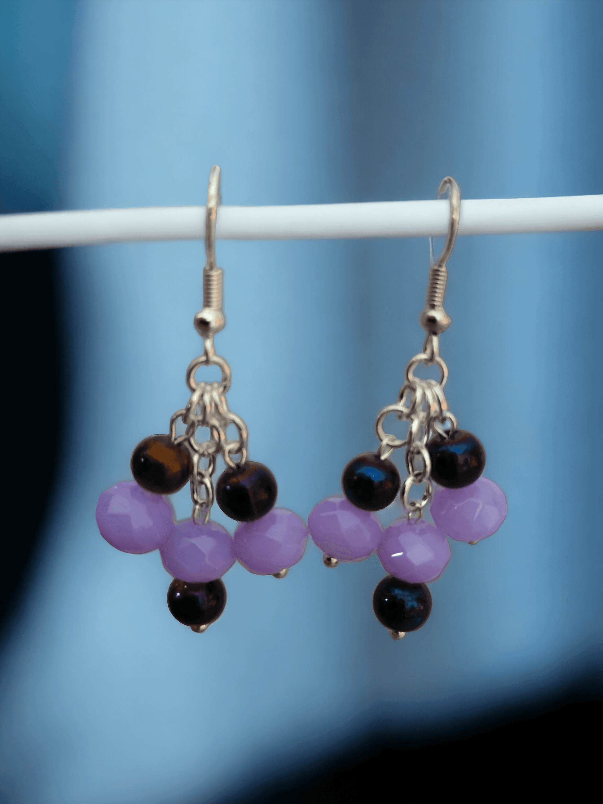 Gorgeous chandelier earrings with light lavender and dark purple glass beads from Zee’s Pieces, featuring faceted rondelle shapes and silver-toned metal components, perfect for adding elegance and sophistication to any outfit, ideal for both casual and formal occasions. Beaded earrings. Handcrafted jewelry. Gift ideas for women. Unique design.