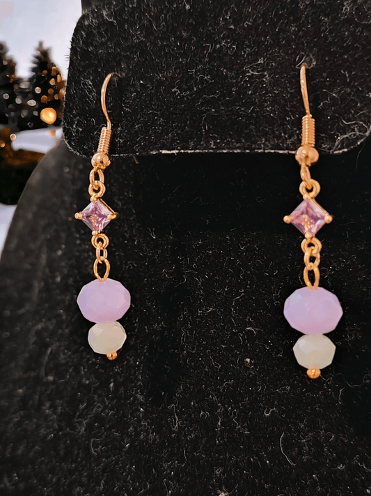 Earrings with Light Purple Gems and Glass Beads - from Zee's Pieces - Elegant dangle earrings featuring a square pendant with a light purple glass gem, a light purple faceted rondelle bead, and a small white bead, all on golden sterling silver hardware. Perfect for adding a touch of sophistication and class to any outfit. On sale for only $19.99! 