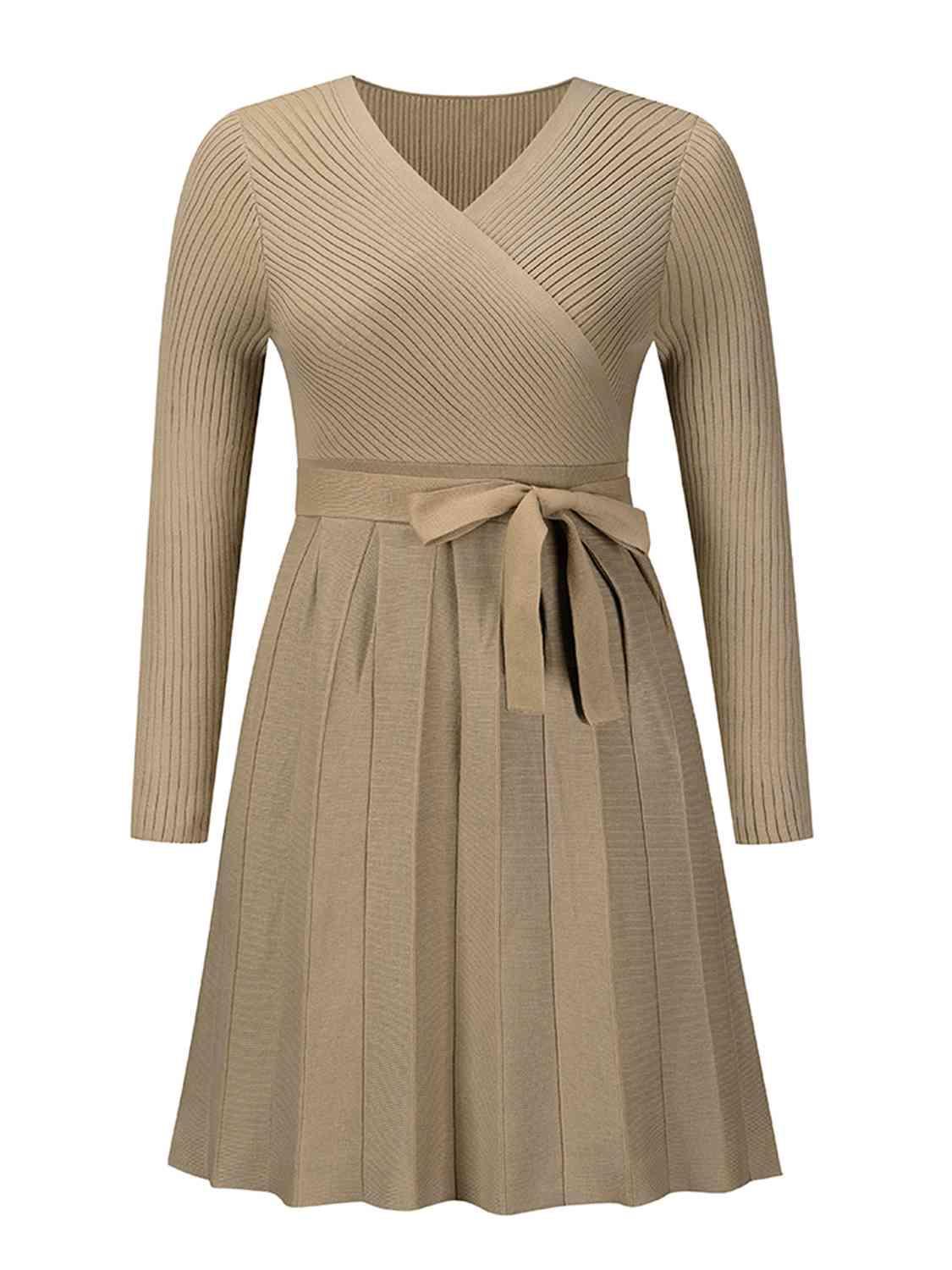 Surplice Neck Tie Front Pleated Sweater Dress - Zee's Pieces. Image of Surplice Neck Tie Front Pleated Sweater Dress, fitted ribbed top, long sleeves, pleated skirt, stylish V-shaped neckline, cozy and chic fall and winter fashion. Army Green, Black, Charcoal Gray, and Khaki colors available. 