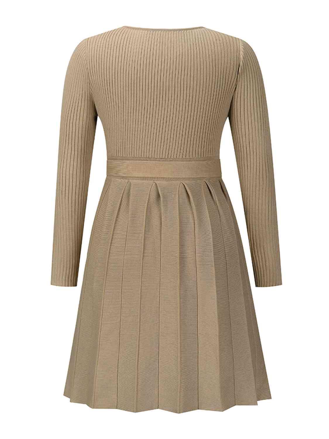 Surplice Neck Tie Front Pleated Sweater Dress - Zee's Pieces. Image of Surplice Neck Tie Front Pleated Sweater Dress, fitted ribbed top, long sleeves, pleated skirt, stylish V-shaped neckline, cozy and chic fall and winter fashion. Army Green, Black, Charcoal Gray, and Khaki colors available. 